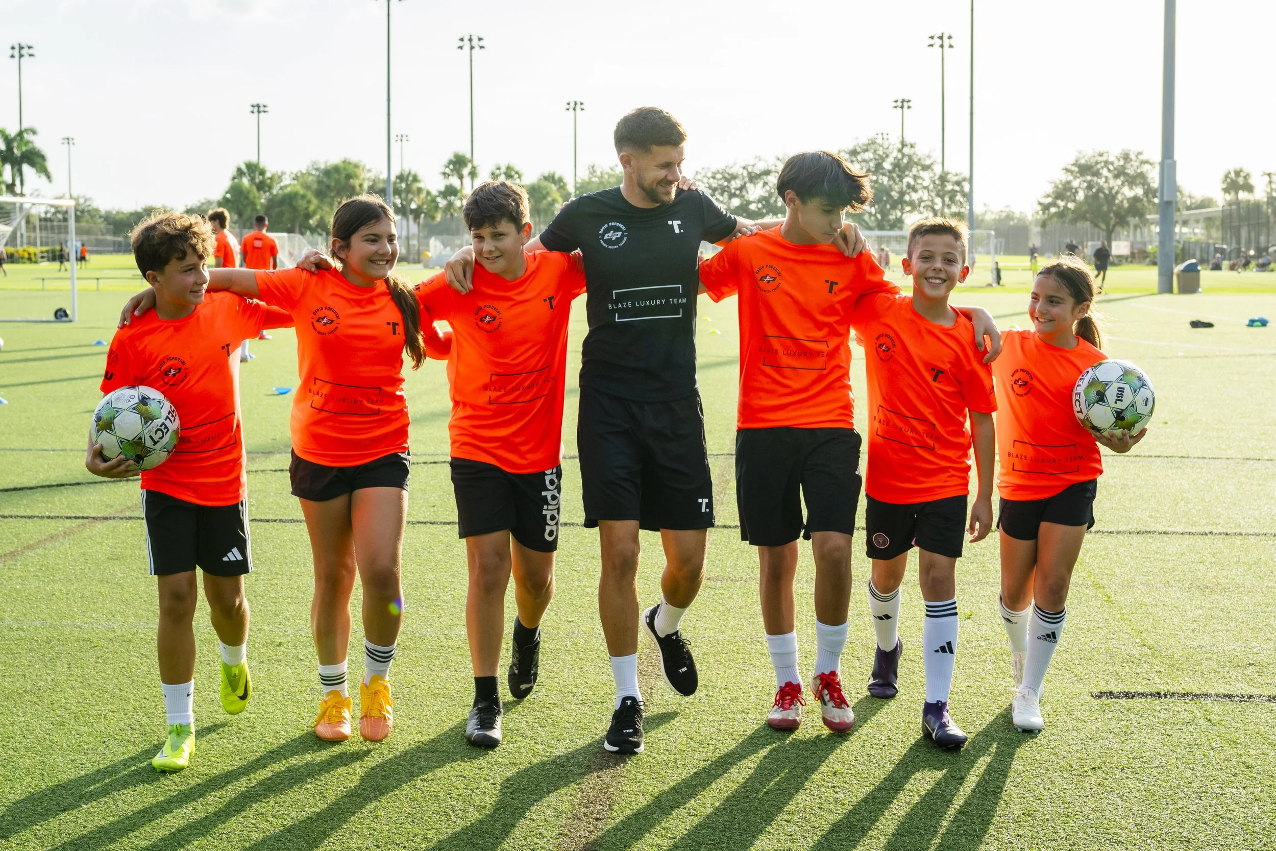 Coach David with a small group of young players in Naples