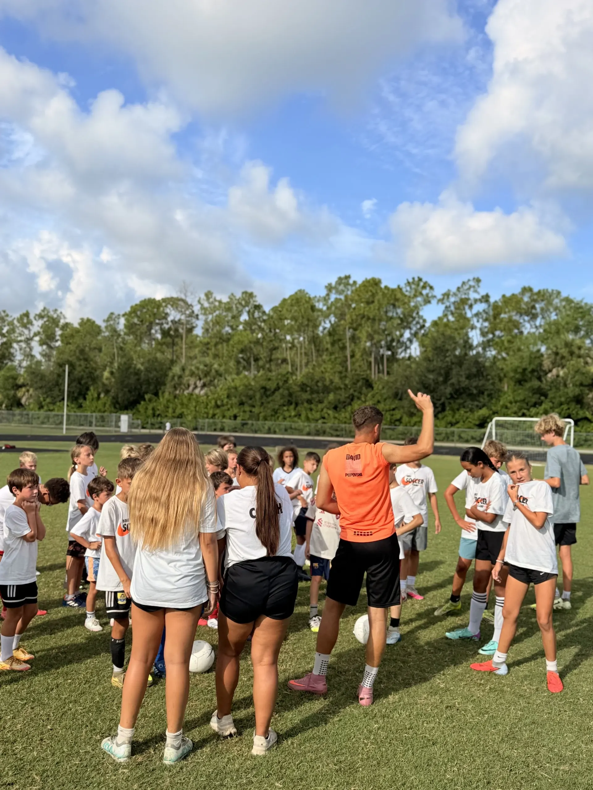 Campers cheering during a drill